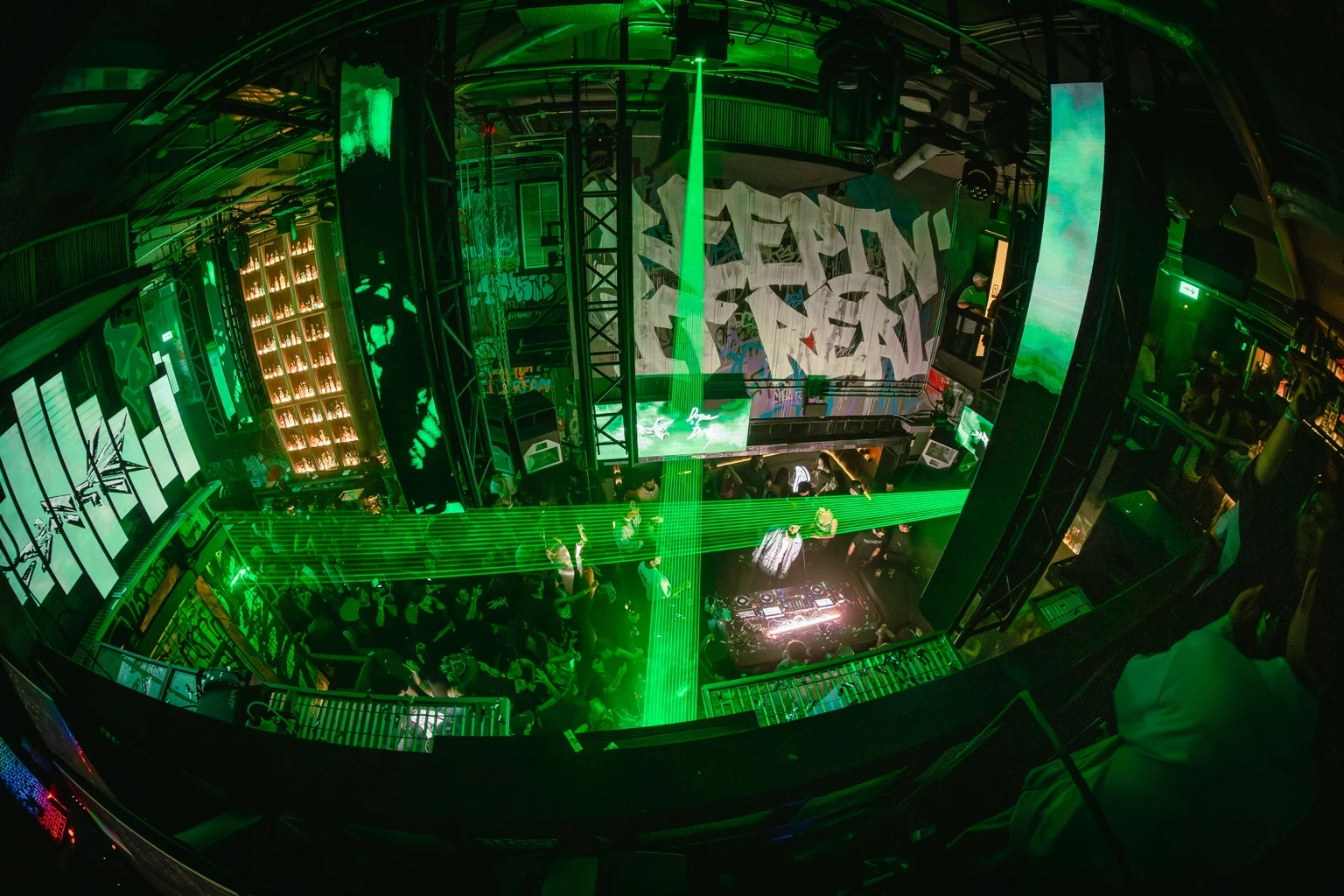 Wide-angle view of the room in green light